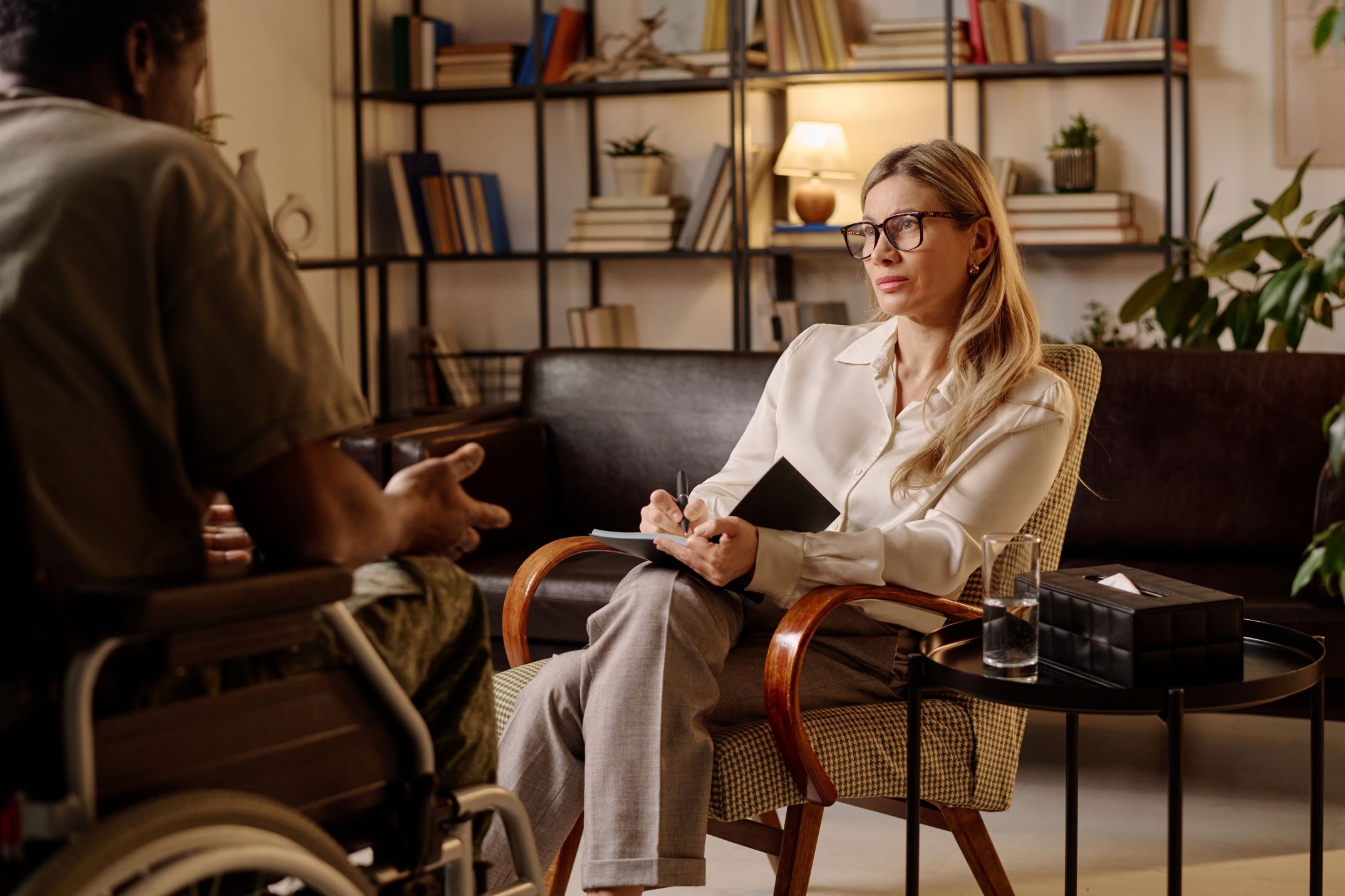 female-therapist-listening-to-her-patient-and-writ-2026-01-08-00-14-11-utc - Copy